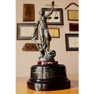 statue of lady justice on desk